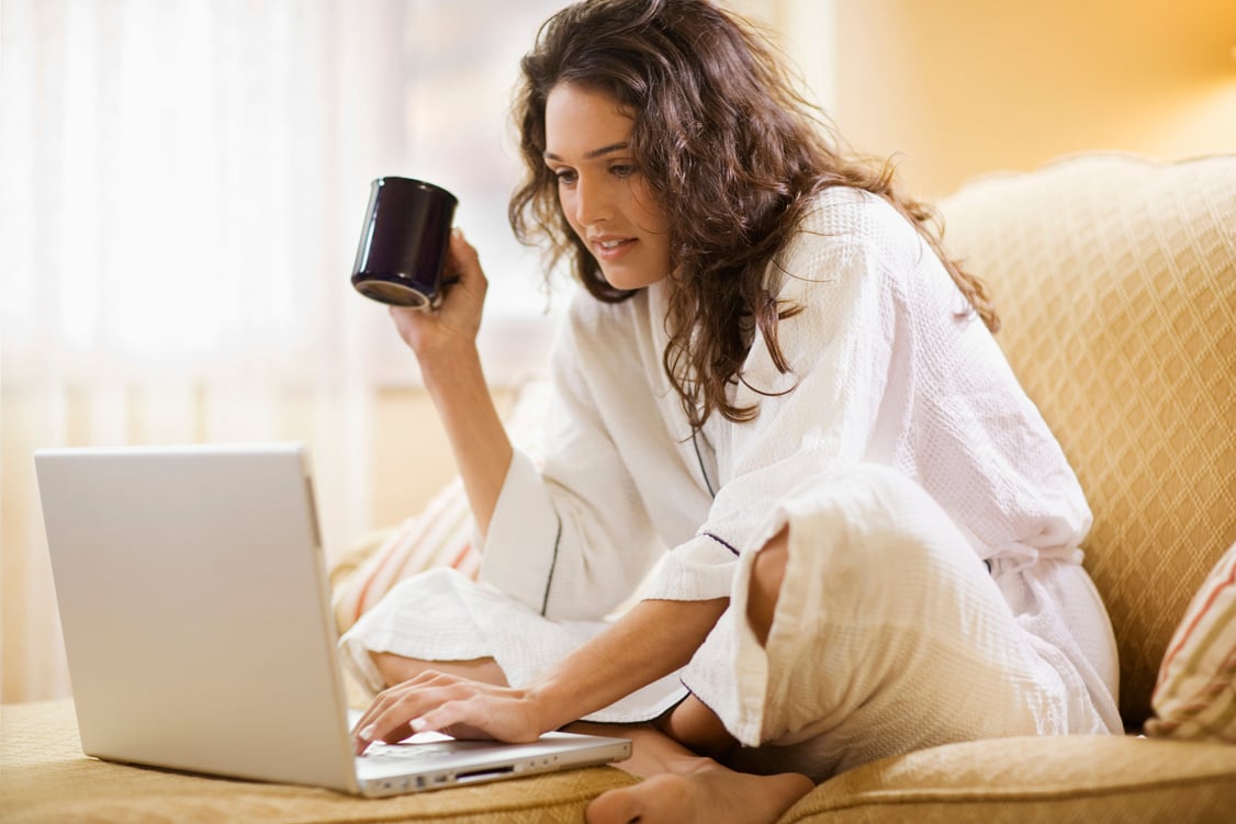 Woman working at home with laptop computer